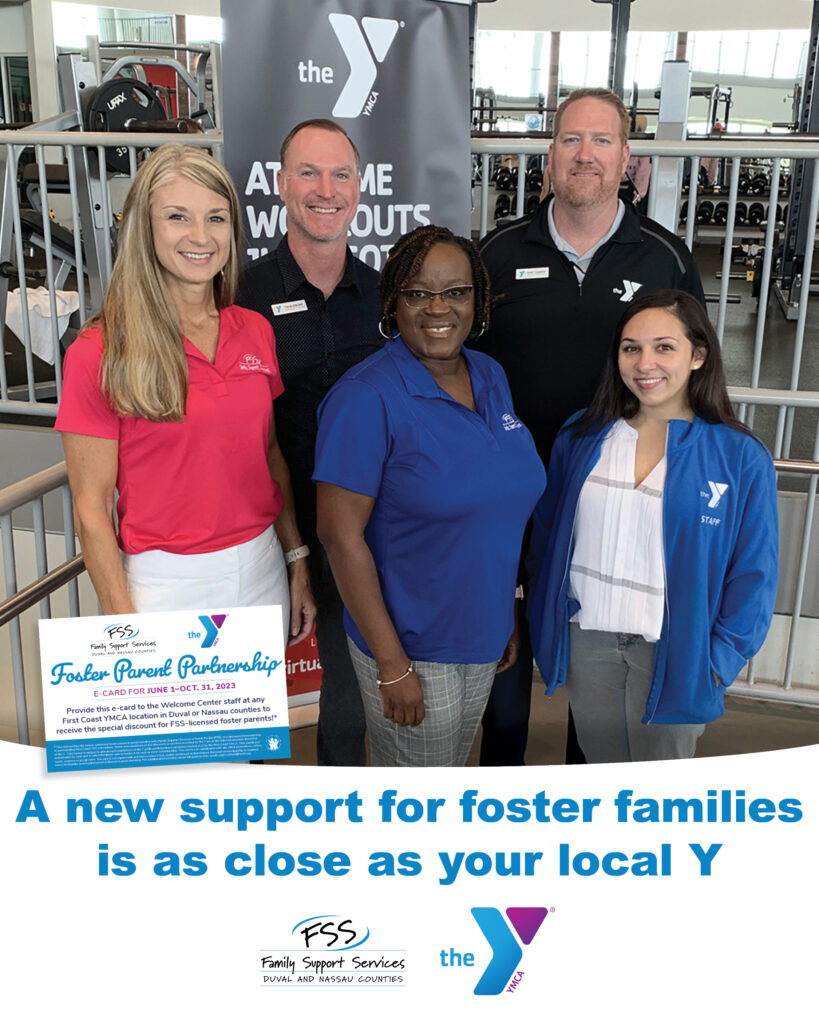A group of smiling staff members from Family Support Services and the First Coast YMCA stand in the Winston YMCA gym. The text reads "A new support for foster families is as close as your local Y."